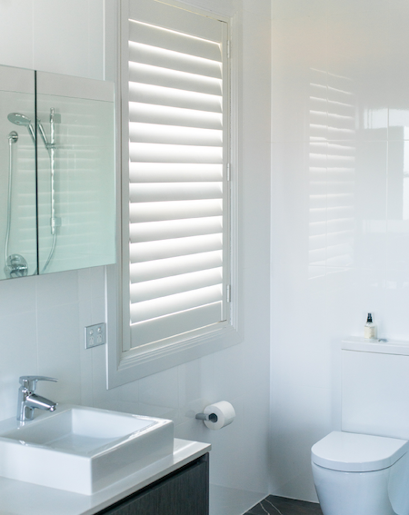 shutters in the bathroom to control light and privacy
