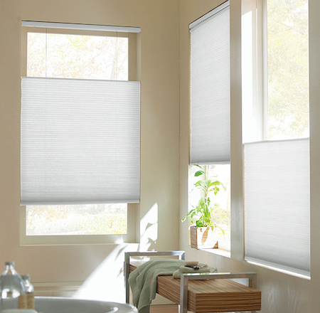 showing the versatility and control options of honeycomb blinds in the bathroom