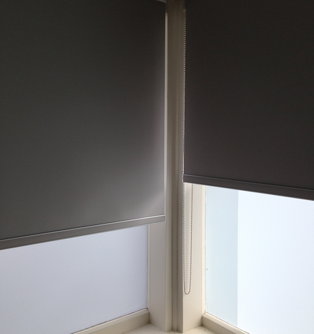two blockout blinds in a bedroom