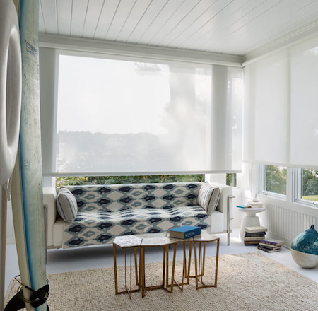 seaside lounge room with white sunscreen blinds