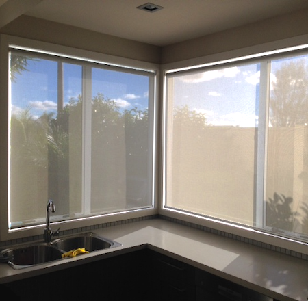 sunscreen blinds reducing glare in a kitchen