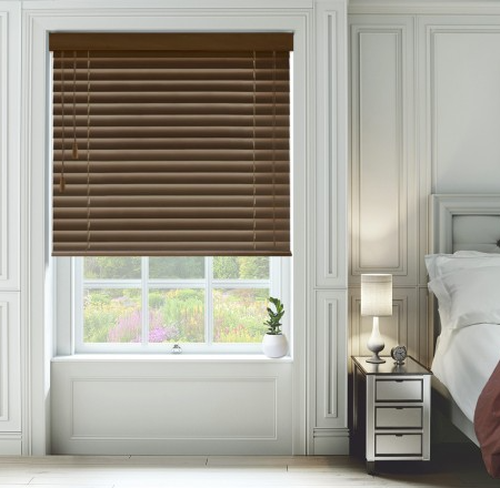 dark wood colour wooden blinds in the master bedroom