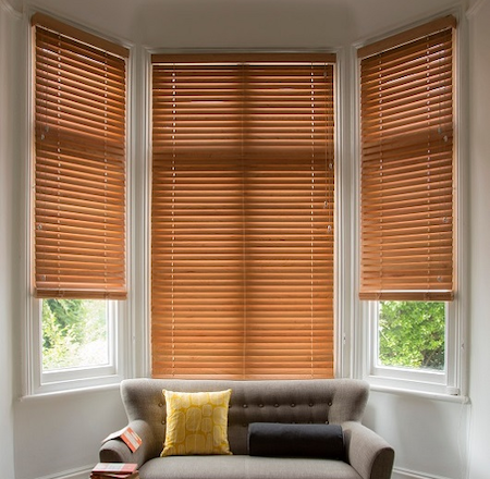 wooden blinds in a bay window area